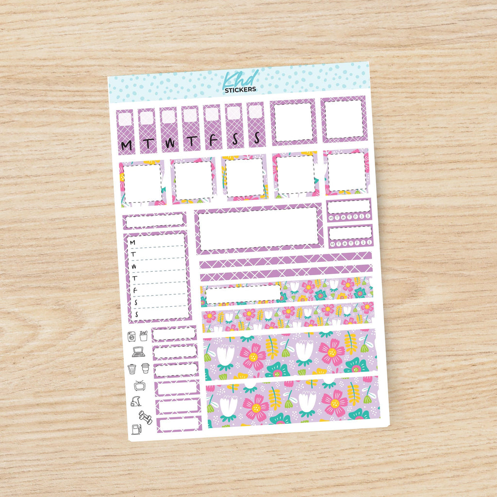 a planner sticker with flowers on it