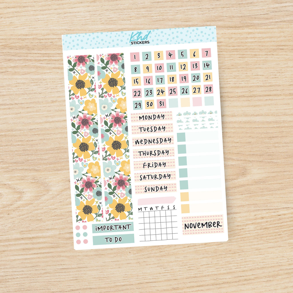 a planner sticker with flowers on it