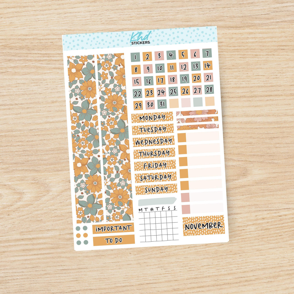 a planner sticker with flowers on it